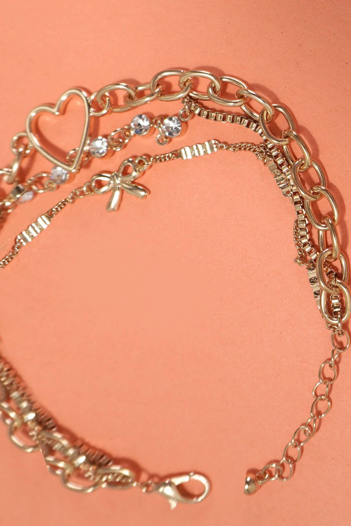JOSSLYN by wall to wall - MULTI LAYER BOW HEART STATION RHINESTONE BRACELET | 80B237