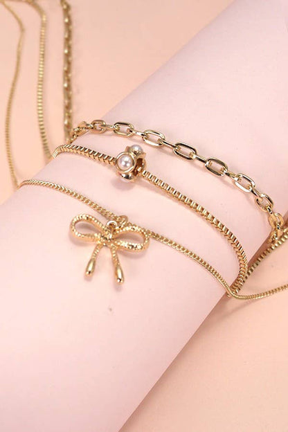 JOSSLYN by wall to wall - MULTI LAYER PEARL BOW CHARM NECKLACE | 80N605
