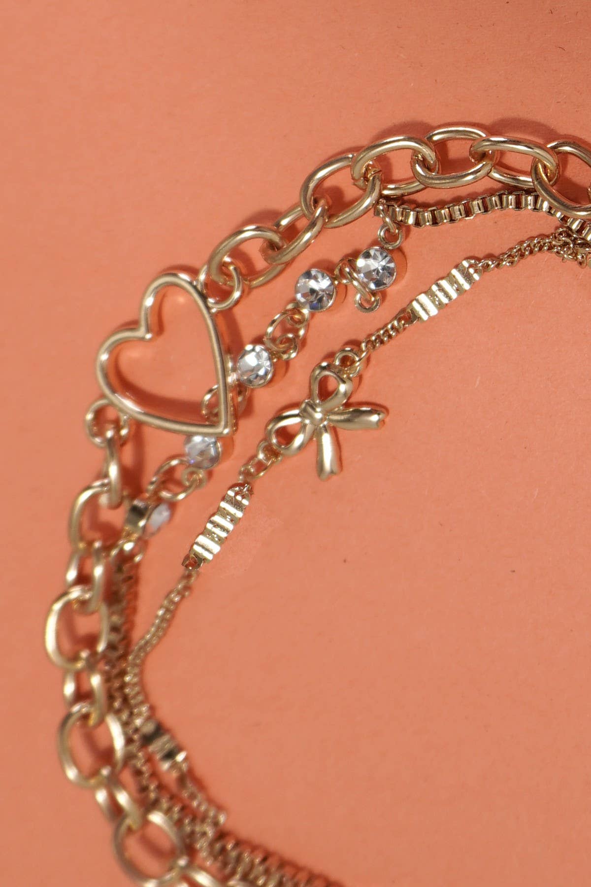 JOSSLYN by wall to wall - MULTI LAYER BOW HEART STATION RHINESTONE BRACELET | 80B237