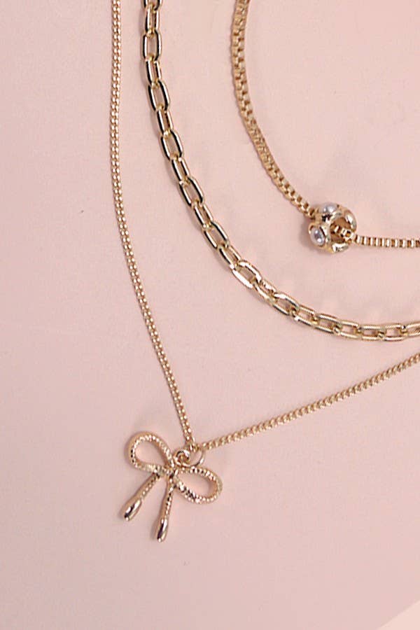JOSSLYN by wall to wall - MULTI LAYER PEARL BOW CHARM NECKLACE | 80N605