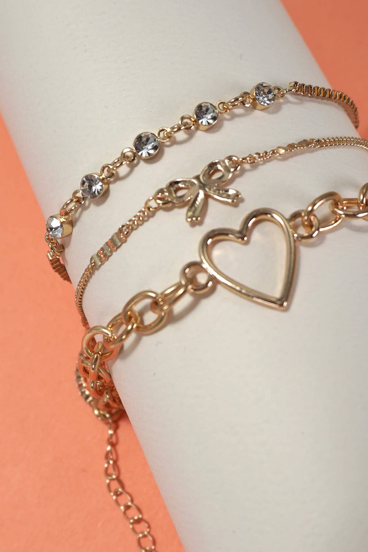 JOSSLYN by wall to wall - MULTI LAYER BOW HEART STATION RHINESTONE BRACELET | 80B237