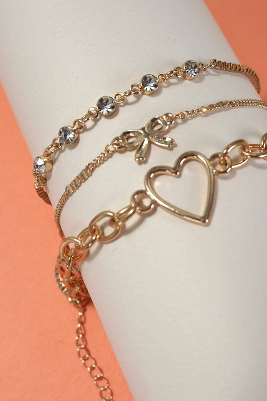 JOSSLYN by wall to wall - MULTI LAYER BOW HEART STATION RHINESTONE BRACELET | 80B237