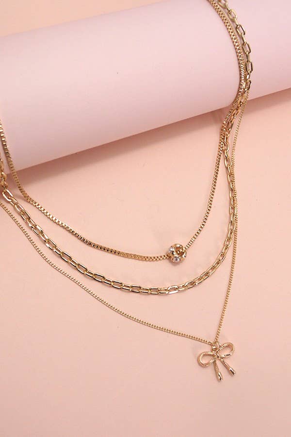 JOSSLYN by wall to wall - MULTI LAYER PEARL BOW CHARM NECKLACE | 80N605